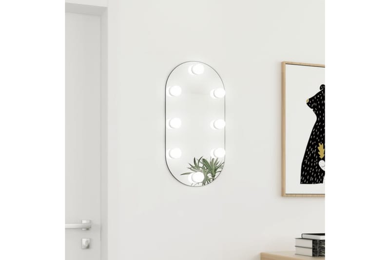 Spegel med LED-lampor 60x30 cm glas oval - Silver - Väggspegel - Hallspegel