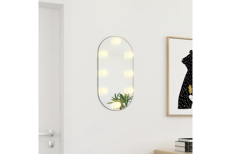 Spegel med LED-lampor 60x30 cm glas oval - Silver - Inredning - Speglar - Väggspegel