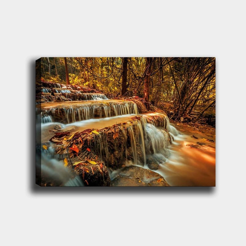 Canvastavla 70x100 cm - Ett vackert vattenfall som rinner ner för flera nivåer i en höstfärgad skog, Guld / Brunt / Orange