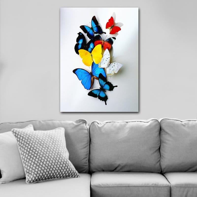 Canvastavla 70x100 cm - Färgglad samling av fjärilar i olika nyanser som skapar en livfull och dynamisk komposition - Blå / Gul / Röd - Inredning - Tavlor & konst - Canvastavlor