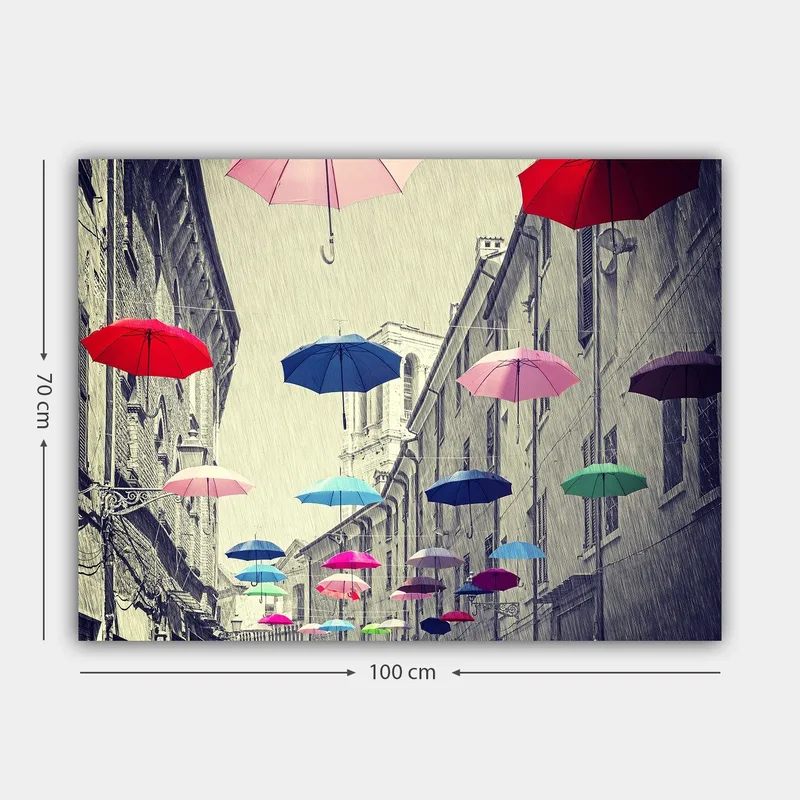 Canvastavla 70x100 cm - Färgglada paraplyer sväva över en grå stadsgata - Röd / Blå / Rosa - Inredning - Tavlor & konst - Canvastavlor