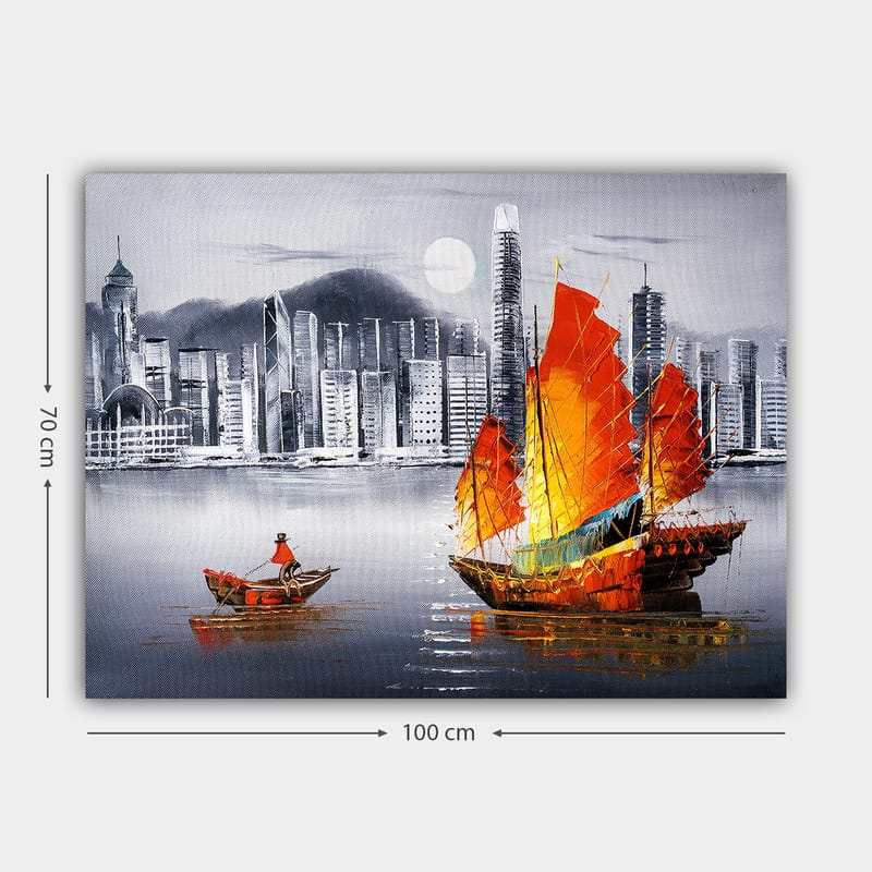 Canvastavla 70x100 cm - Färgstark segelbåt med röda segel på en spegelblanka vattenyta, omgiven av en modern stadsbild - Röd / Orange / Blå - Inredning - Tavlor & konst - Canvastavlor