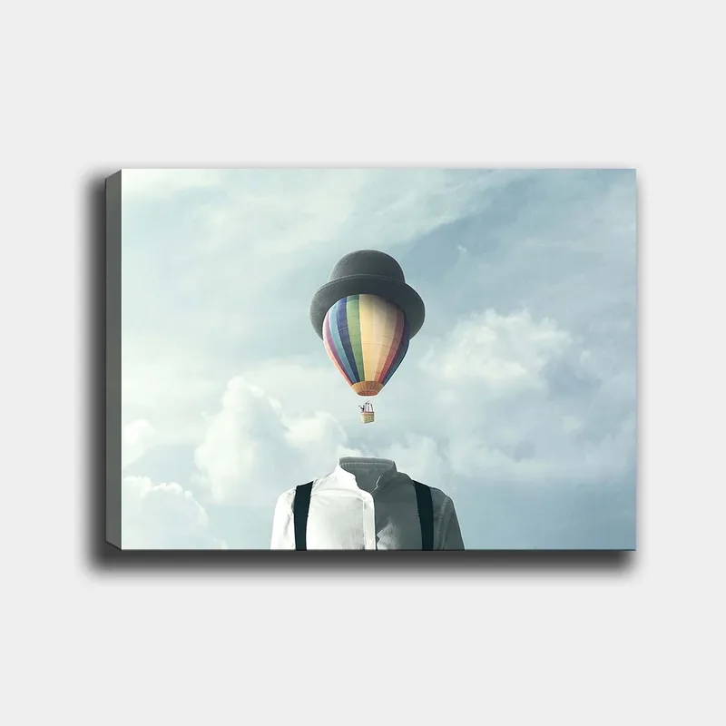 Canvastavla 70x100 cm - Huvudlös man i vit skjorta och svart hatt, med en färgglad luftballong svävande ovanför, Vit / Svart / Regnbågsfärgad