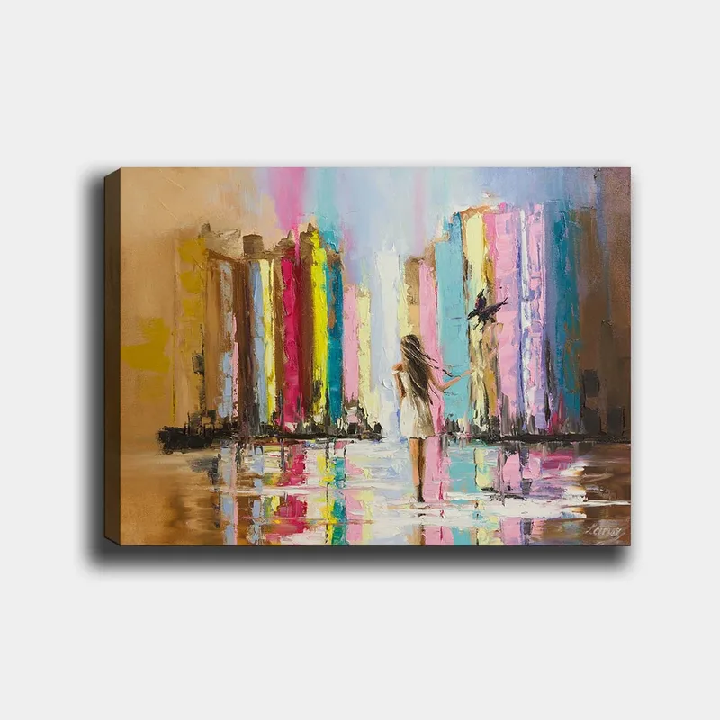 Canvastavla 70x100 cm - Kvinna i vit klänning går genom en färgglad stad med höga byggnader i bakgrunden, Rosa / Gul / Blå