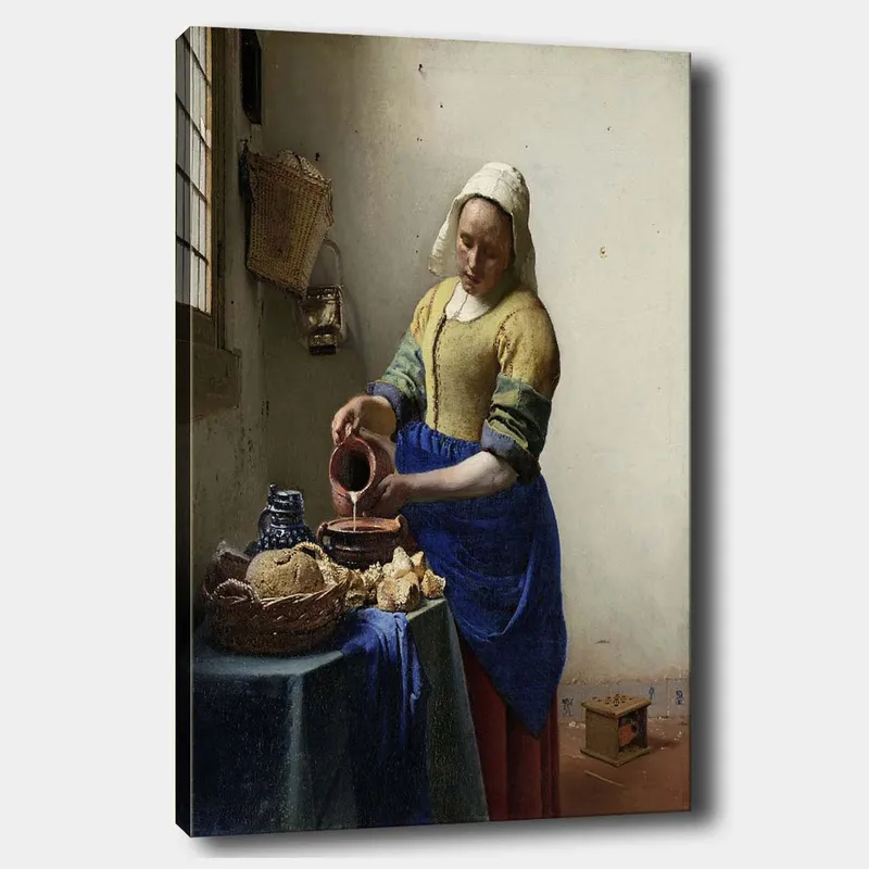 Canvastavla 70x100 cm - Kvinna som häller mjölk i en skål i ett ljust kök - Blå / Gul / Brun - Inredning - Tavlor & konst - Canvastavlor
