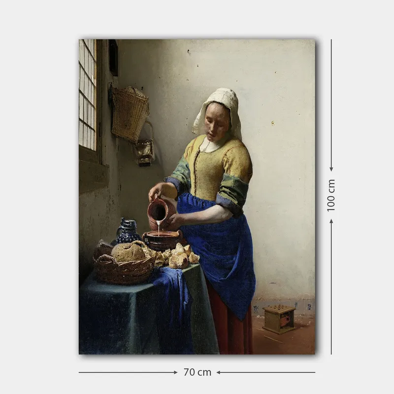 Canvastavla 70x100 cm - Kvinna som häller mjölk i en skål i ett ljust kök - Blå / Gul / Brun - Inredning - Tavlor & konst - Canvastavlor