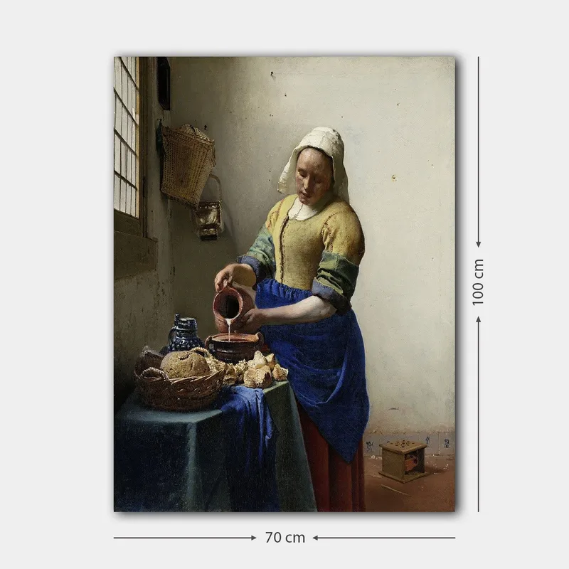 Canvastavla 70x100 cm - Kvinna som häller mjölk i en skål i ett ljust kök - Blå / Gul / Brun - Inredning - Tavlor & konst - Canvastavlor