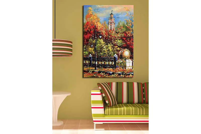 Canvastavla 70x100 cm - Livlig höstscen med en klocktorn i bakgrunden omgiven av färgglada träd och lampor - Röd / Orange / Grön - Inredning - Tavlor & konst - Canvastavlor