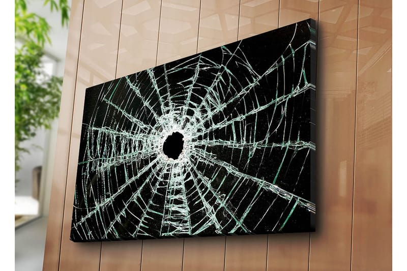 Canvastavla 70x100 cm - Närbild av en sprucken glasruta med ett centralt hål och sprickor som sträcker sig utåt - Svart / Genomskinlig - Inredning - Tavlor & konst - Canvastavlor