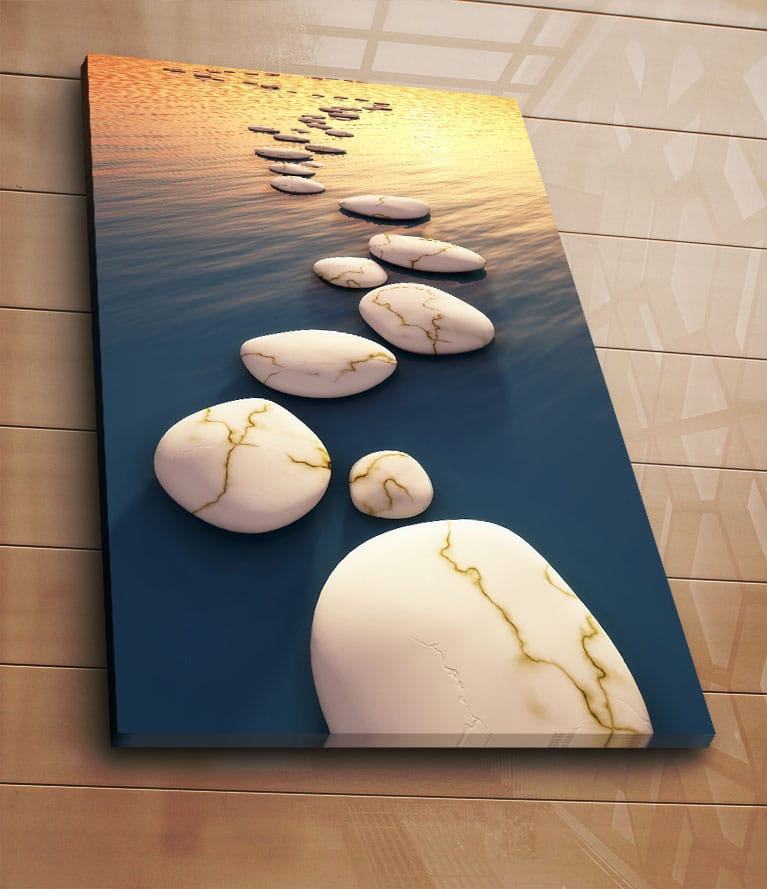 Canvastavla 70x100 cm - Serie av vita stenar med guldiga ådror som flyter på en djupblå yta vid solnedgången - Vit / Blå / Guld - Inredning - Tavlor & konst - Canvastavlor