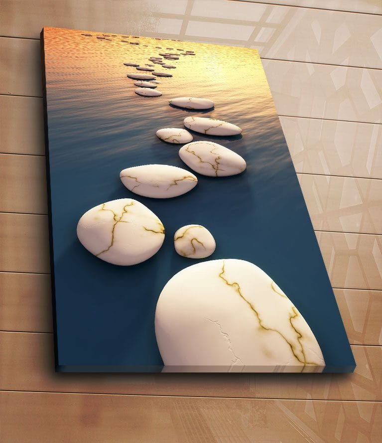 Canvastavla 70x100 cm - Serie av vita stenar med guldiga ådror som flyter på en djupblå yta vid solnedgången - Vit / Blå / Guld - Inredning - Tavlor & konst - Canvastavlor