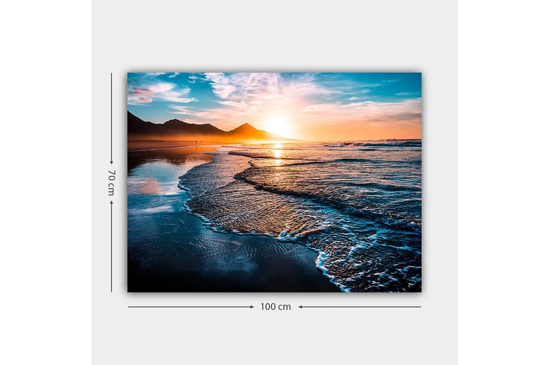 Canvastavla 70x100 cm - Solnedgång över en strand med mjuka vågor som rullar in mot kusten - Blå / Orange / Turkos - Inredning - Tavlor & konst - Canvastavlor