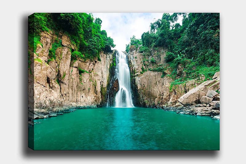 Canvastavla 70x100 cm - Storslagen vattenfall som forsar ner i en klar, turkos sjö omgiven av grönskande klippor, Turkos / Grön / Beige