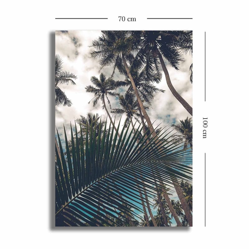 Canvastavla 70x100 cm - Tropisk palmlund med en stor palmblad i förgrunden - Mörkgrön / Ljusgrön / Blå - Inredning - Tavlor & konst - Canvastavlor