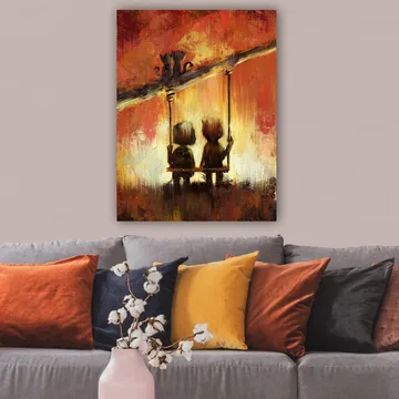 Canvastavla 70x100 cm - Två figurer som sitter på en gunga under en varm, färgsprakande himmel - Röd / Orange / Gul - Inredning - Tavlor & konst - Canvastavlor