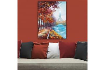 Canvastavla 70x100 cm - Vacker höstscen med Eiffeltornet i bakgrunden, omgiven av färgglada träd och en glittrande flod - Röd / Blå / Orange - Inredning - Tavlor & konst - Canvastavlor