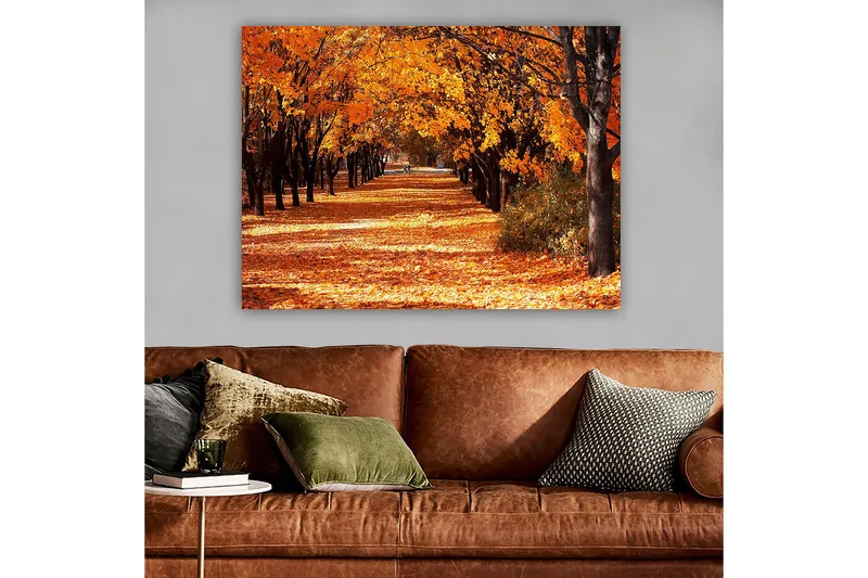 Canvastavla 70x100 cm - Vacker höstscen med träd i starka orangea och gula nyanser som skapar en inbjudande gångväg täckt av fallna löv - Orange / Gult / Brunt - Inredning - Tavlor & konst - Canvastavlor