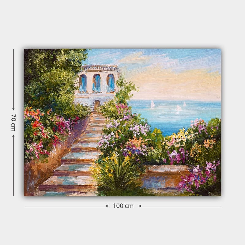 Canvastavla 70x100 cm - Vacker trappa omgiven av färgglada blommor som leder ner till havet och en byggnad med blå fönster - Grön / Rosa / Blå - Inredning - Tavlor & konst - Canvastavlor