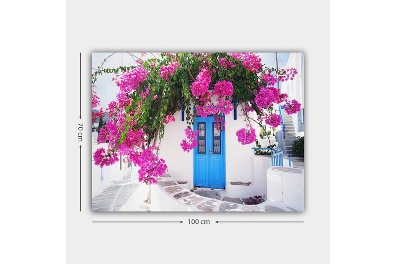 Canvastavla 70x100 cm - Vacker vit byggnad med en blå dörr omgiven av lila blommor - Lila / Blå / Grön - Inredning - Tavlor & konst - Canvastavlor