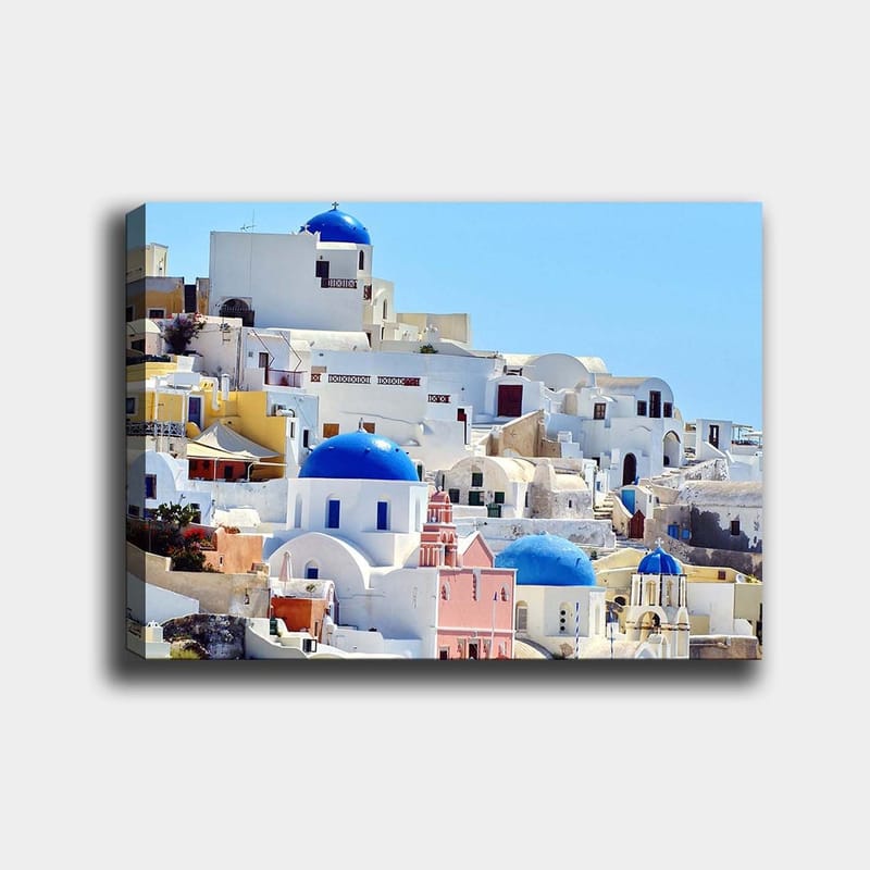 Canvastavla 70x100 cm - Vacker vy över de karakteristiska vita husen och blå kupolerna i Santorini, Blå / Vit / Rosa