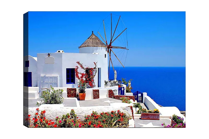 Canvastavla 70x100 cm - Pittoresk vy av en vitkalkad byggnad med en traditionell vindmölla och färgglada blommor i Santorini, Vit / Blå / Röd