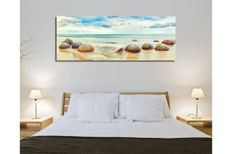 Canvastavla 80x30 cm - Runda stenar vid en strand med hav och himmel i bakgrunden - Blå / Beige / Grå - Inredning - Tavlor & konst - Canvastavlor