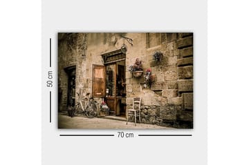 Canvastavla - Charmig gatumiljö med en cykel och en öppen dörr till en butik - Beige / Brunt / Grönt - Inredning - Tavlor & konst - Canvastavlor
