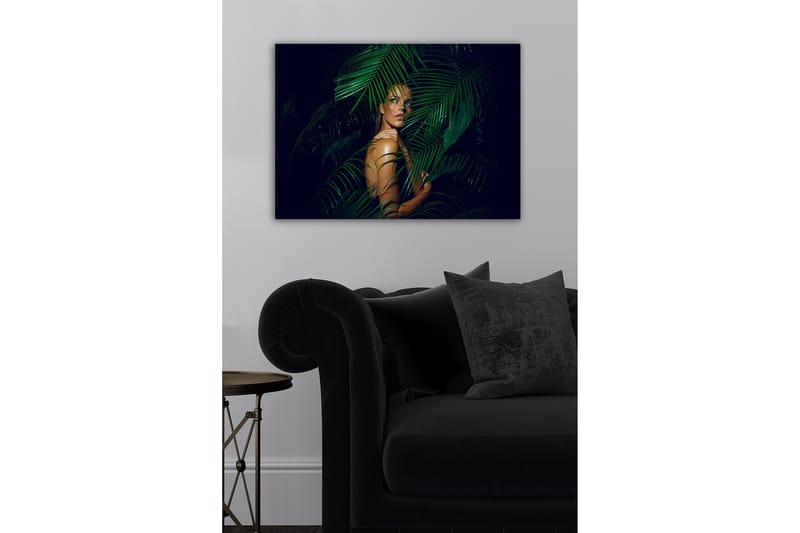 Canvastavla - Kvinna delvis dold bakom gröna palmblad - Mörkgrön / Hudton / Svart - Inredning - Tavlor & konst - Canvastavlor