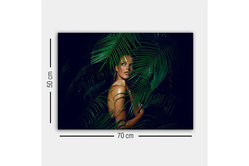 Canvastavla - Kvinna delvis dold bakom gröna palmblad - Mörkgrön / Hudton / Svart - Inredning - Tavlor & konst - Canvastavlor