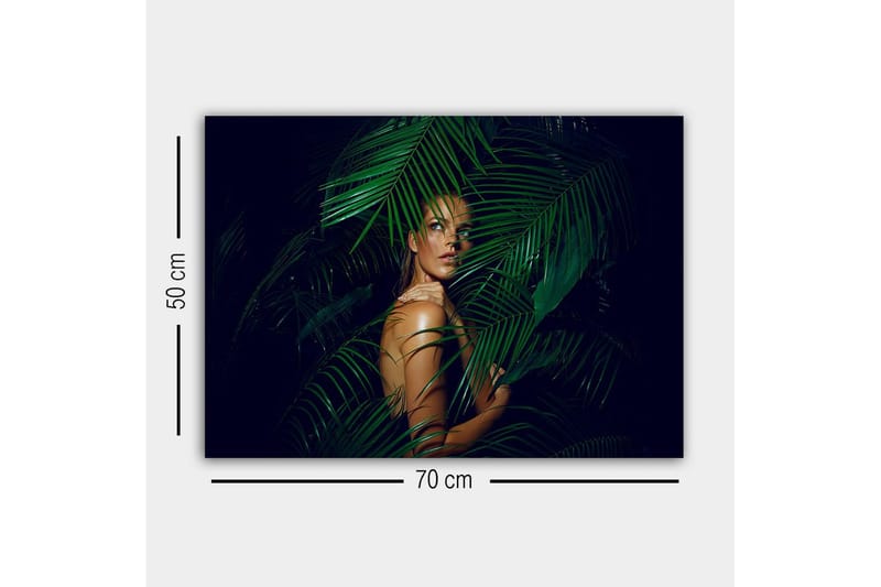 Canvastavla - Kvinna delvis dold bakom gröna palmblad - Mörkgrön / Hudton / Svart - Inredning - Tavlor & konst - Canvastavlor