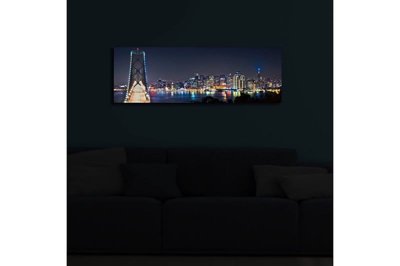 Canvastavla med LED-belysning 30x90 cm - Nattlig stadsbild med en bro och silhuetter av skyskrapor - Mörkblå / Ljusgrön / Vit - Inredning - Tavlor & konst - Canvastavlor