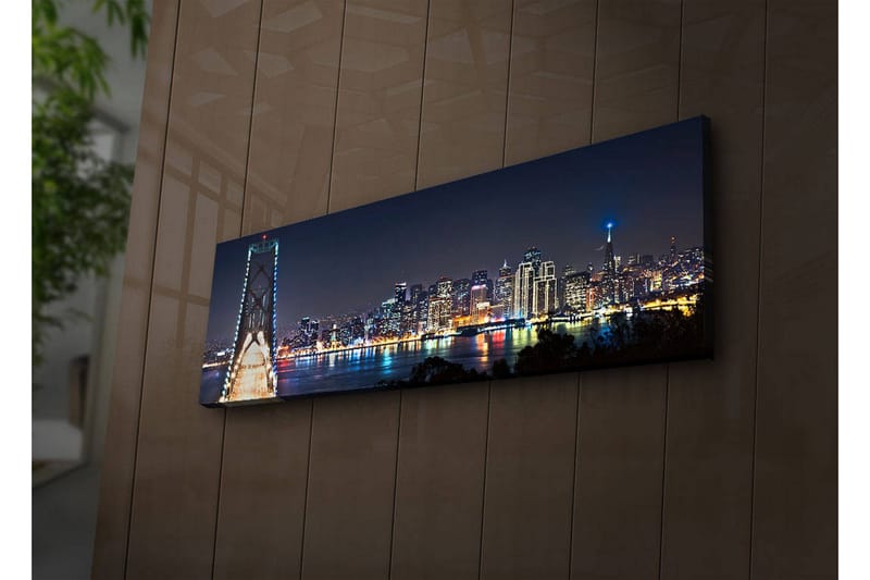 Canvastavla med LED-belysning 30x90 cm - Nattlig stadsbild med en bro och silhuetter av skyskrapor, Mörkblå / Ljusgrön / Vit
