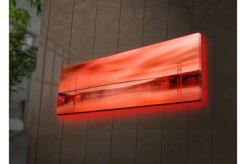 Canvastavla med LED-belysning 30x90 cm - Storslagen vy av en bro över en spegelblanka vattenyta i solnedgångens färger - Röd / Orange / Svart - Inredning - Tavlor & konst - Canvastavlor