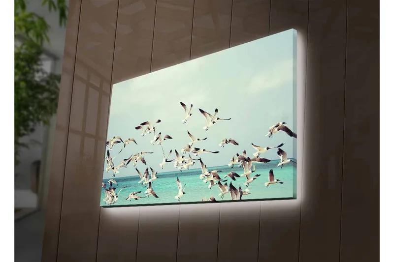 Canvastavla med LED-belysning - Flock av fåglar som flyger över en blå havsyta - Ljusblå / Vit / Svart - Inredning - Tavlor & konst - Canvastavlor