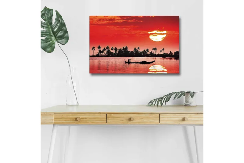 Canvastavla med LED-belysning - Solnedgång över en stilla sjö med silhuetter av palmer och en båt, Röd / Svart / Orange