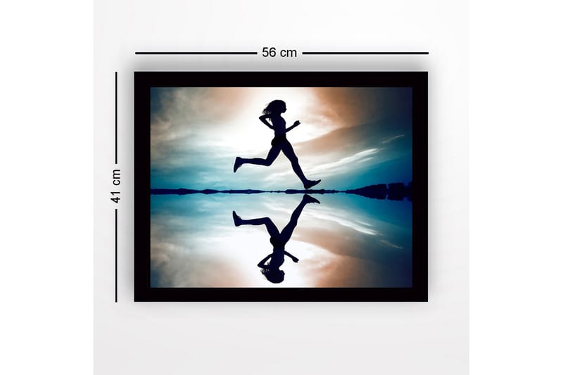 Inramad Canvastavla i trä - 41x56 cm - Silhuett av en löpare i rörelse över en spegelblanka yta - Mörkblå / Orange / Ljusblå - Inredning - Tavlor & konst